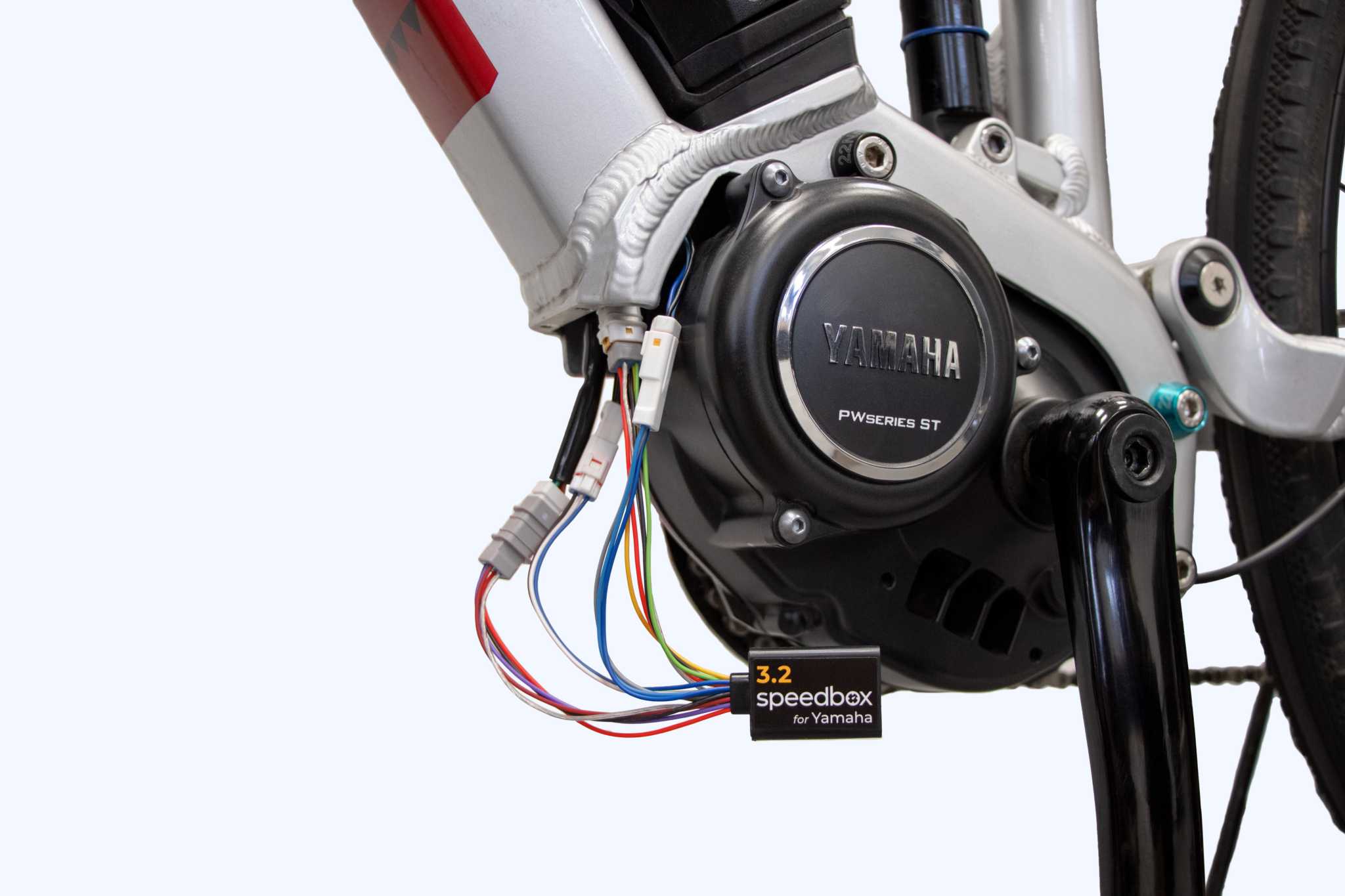 SpeedBox 3.2 module installed on Yamaha e-bike motor for removing speed limit