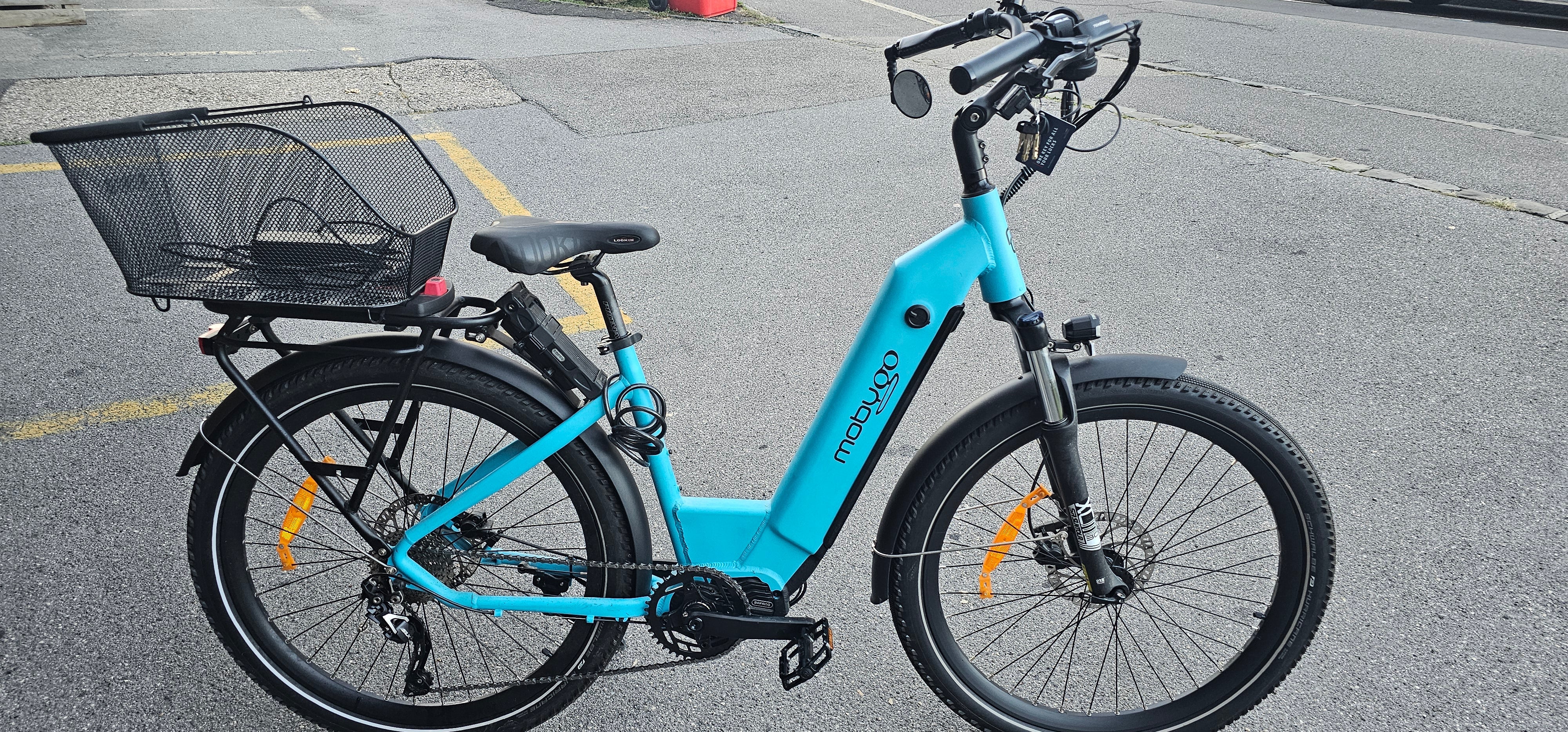 top-of-the-range blue Mobygo electric city-bike with Bafang motor and rear basket