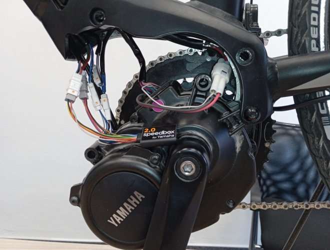 SpeedBox 2.0 module installed on Yamaha UrbanRush electric bike motor for speed limit removal
