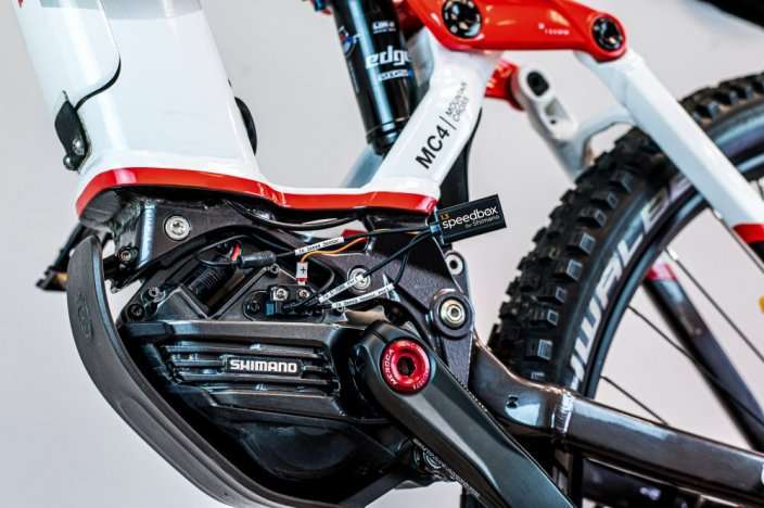 SpeedBox 1.3 tuning module installed on Shimano EP8 electric bike motor to remove 25 km/h speed limit